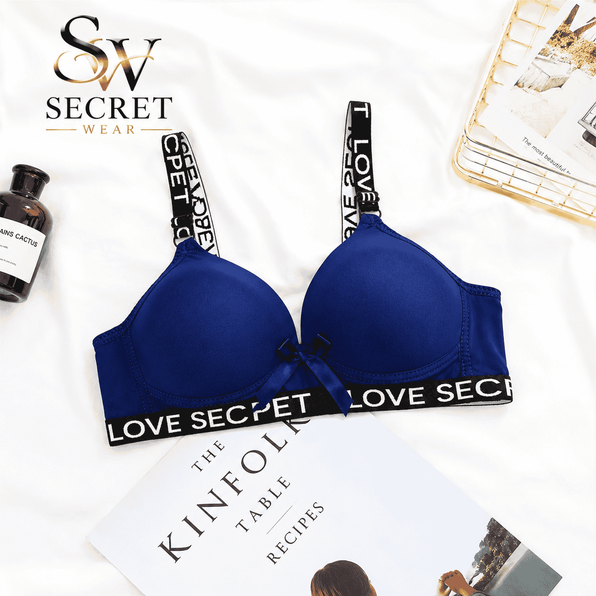 Love Secret Padded Bra in royal blue with smooth contoured cups, black LOVE SECRET printed straps and underband, and a bow.